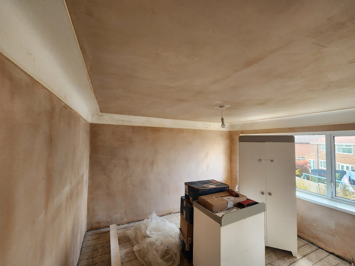 Fresh plastering around a bay window