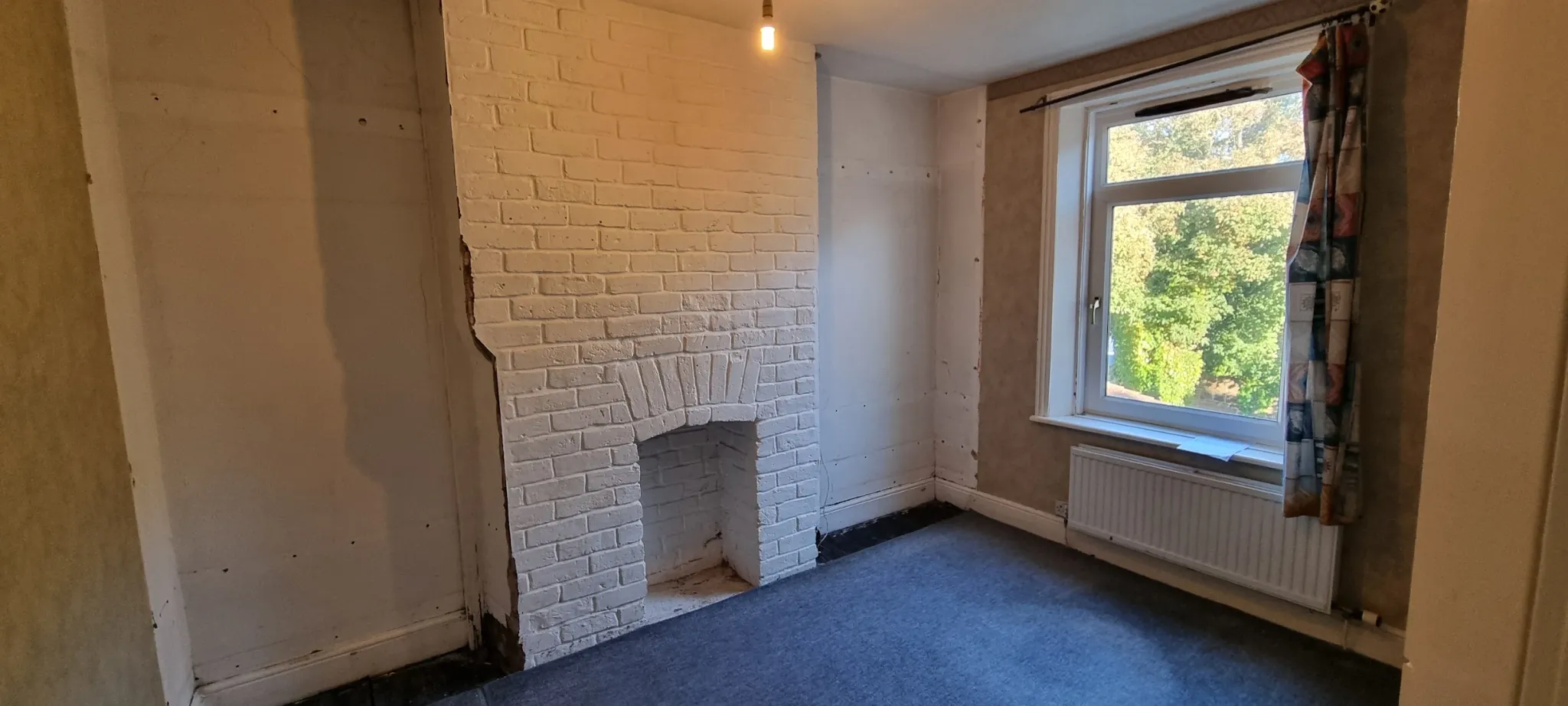 Before plastering photo of room with fireplace